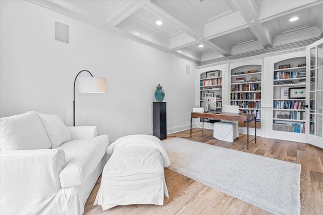 home office featuring beam ceiling, light hardwood / wood-style floors, crown molding, and coffered ceiling