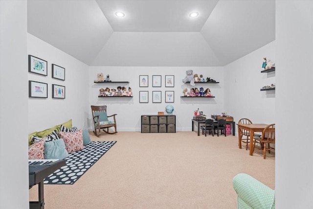 recreation room featuring carpet flooring and lofted ceiling