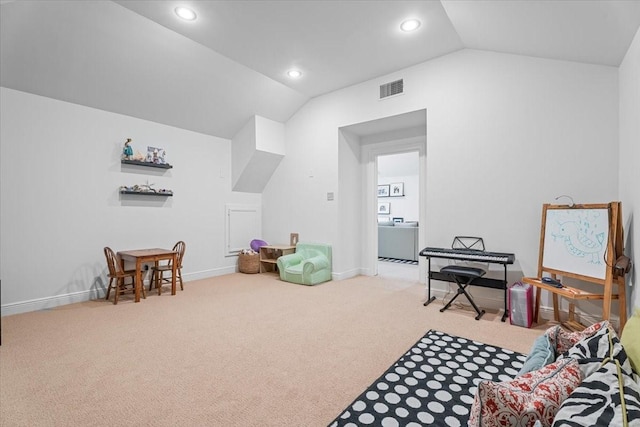 recreation room featuring carpet floors and lofted ceiling