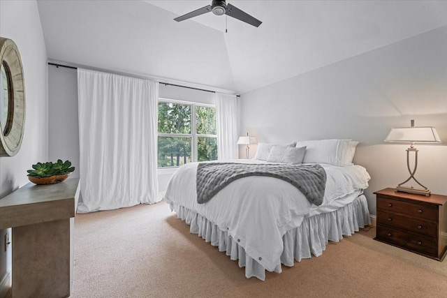 bedroom with ceiling fan, light colored carpet, and lofted ceiling