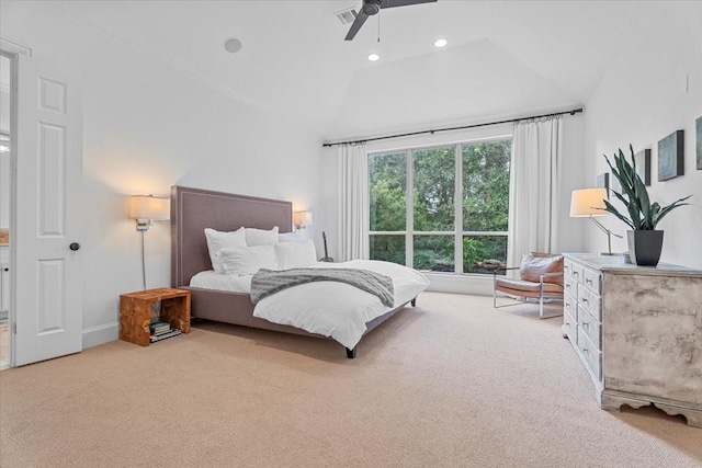 carpeted bedroom with vaulted ceiling and ceiling fan