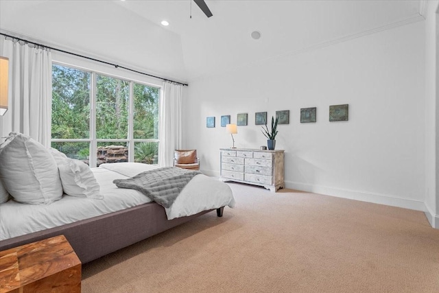 bedroom with ceiling fan, a towering ceiling, and carpet floors