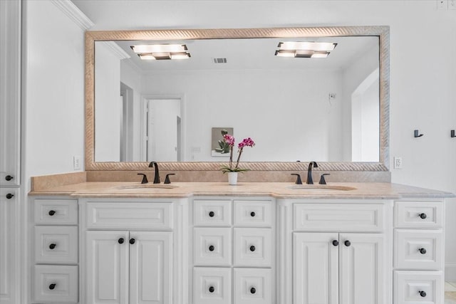 bathroom with vanity and ornamental molding