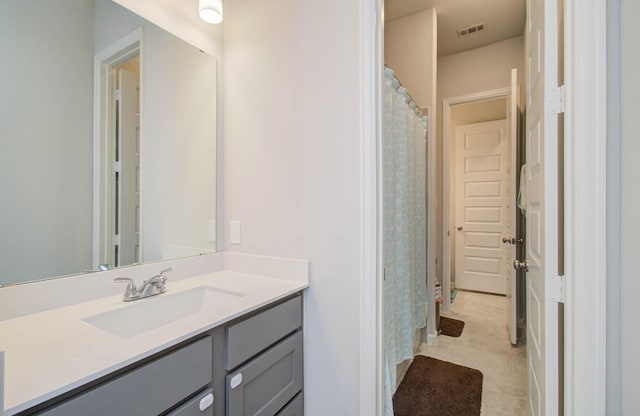 bathroom with tile patterned flooring and vanity