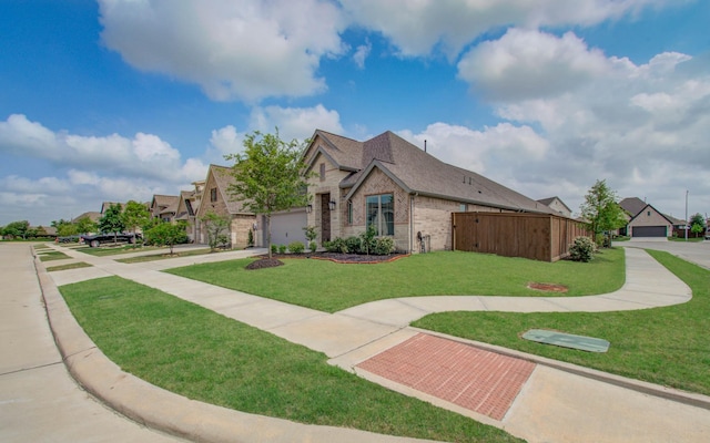 view of front facade with a garage and a front yard