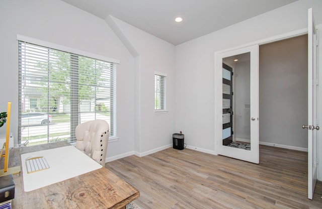 office area with wood-type flooring and french doors