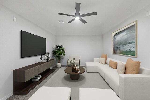 carpeted living room with ceiling fan