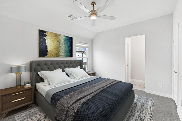 carpeted bedroom with ceiling fan and lofted ceiling