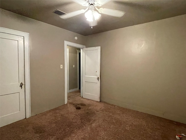 unfurnished bedroom featuring carpet flooring and ceiling fan