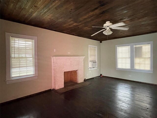 unfurnished living room featuring wooden ceiling, cooling unit, a brick fireplace, ceiling fan, and dark hardwood / wood-style flooring