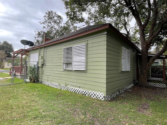 view of property exterior with a lawn