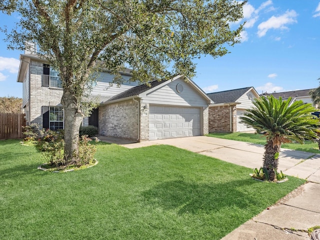 view of front of home with a garage and a front lawn