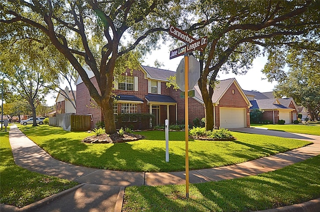 view of front facade featuring a garage and a front yard