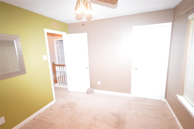 unfurnished bedroom with light carpet