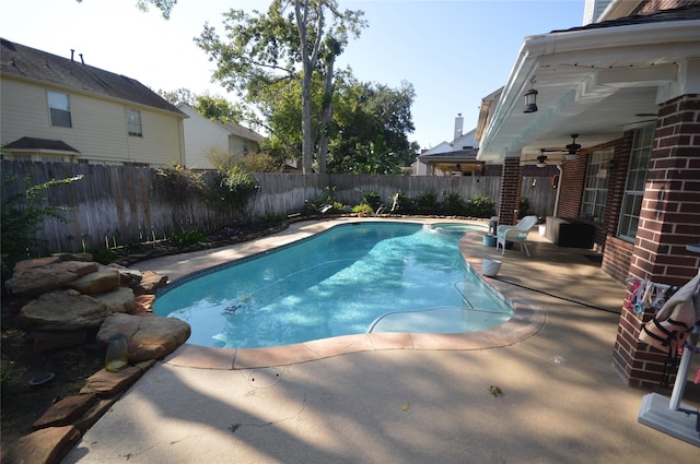 view of pool with a patio area and ceiling fan