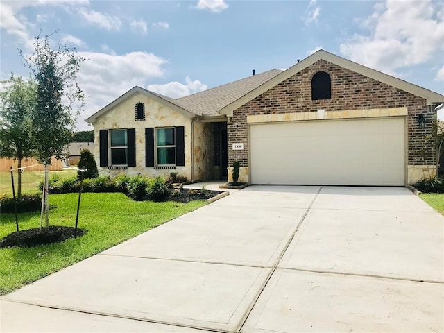 ranch-style home with a front yard and a garage