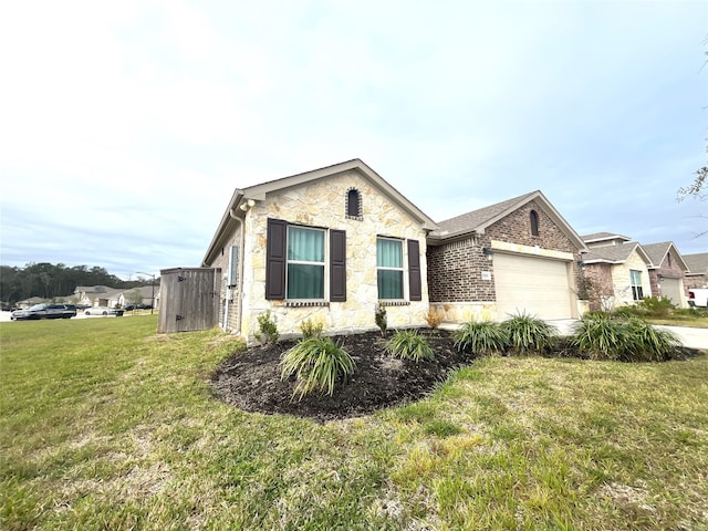 view of front of property featuring a garage and a front yard