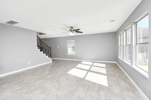 unfurnished living room with ceiling fan