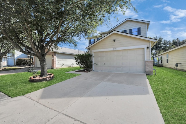 view of front facade with a garage and a front lawn