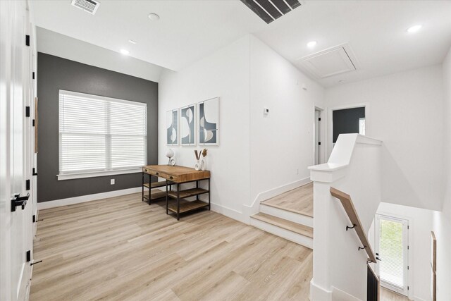 corridor featuring light hardwood / wood-style flooring