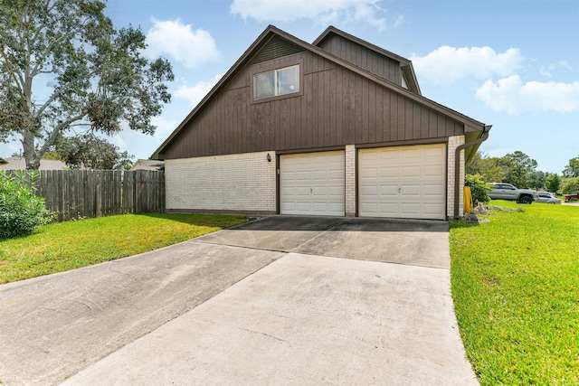 exterior space with a yard and a garage