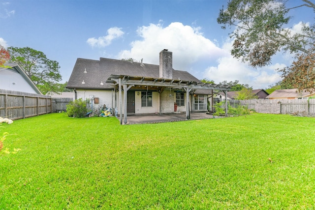 back of property featuring a yard, a pergola, and a patio area