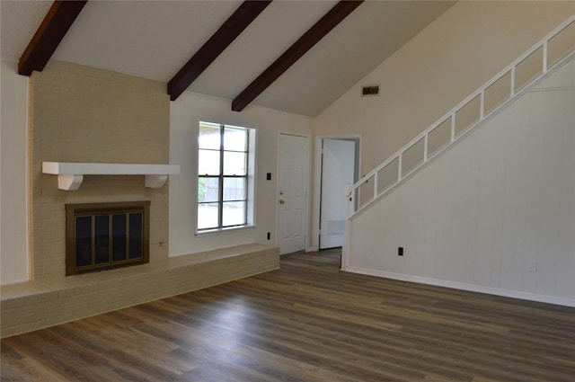 unfurnished living room featuring a fireplace, dark hardwood / wood-style flooring, high vaulted ceiling, and beamed ceiling