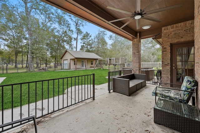 view of patio featuring an outdoor structure, ceiling fan, and an outdoor living space