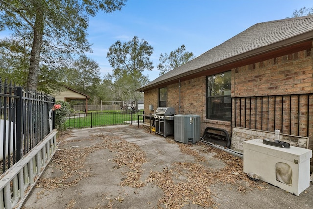 view of patio with central AC unit and grilling area