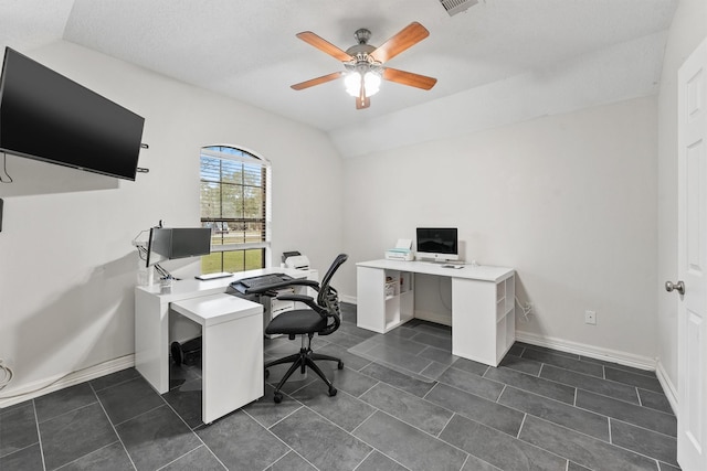 tiled home office featuring ceiling fan, a textured ceiling, and vaulted ceiling