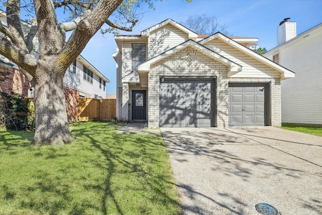 view of property featuring a garage and a front lawn