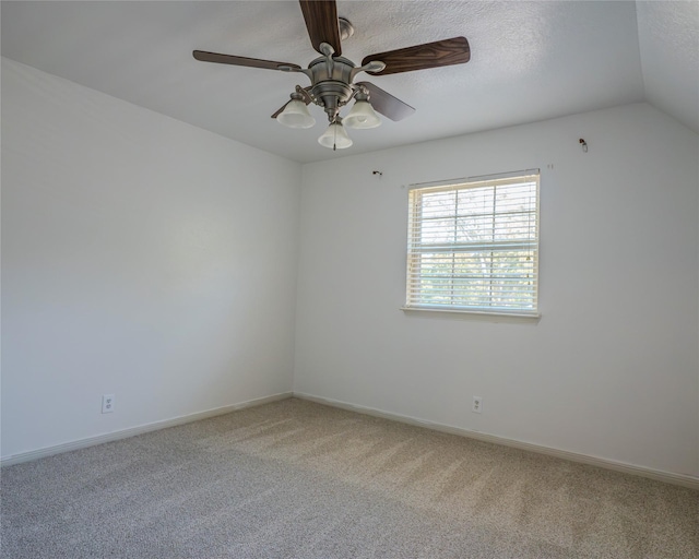 unfurnished room with carpet flooring, ceiling fan, a textured ceiling, and lofted ceiling