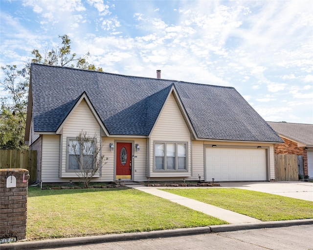 view of front of property with a garage and a front lawn