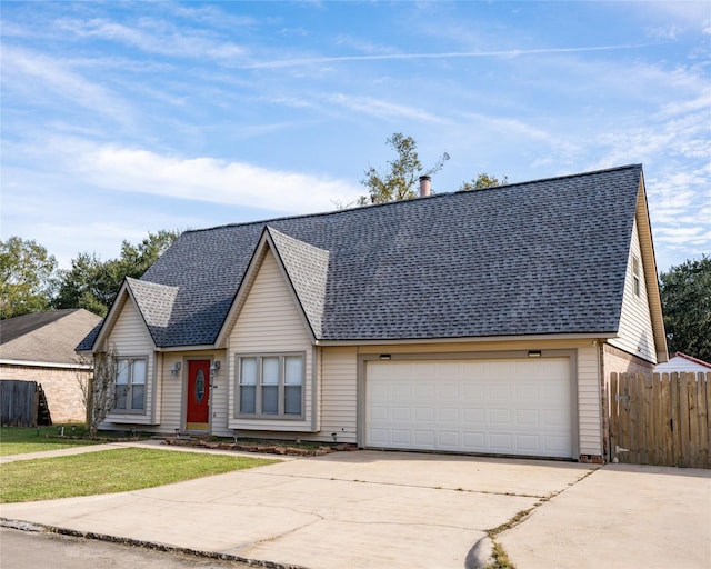 view of front facade featuring a garage and a front lawn