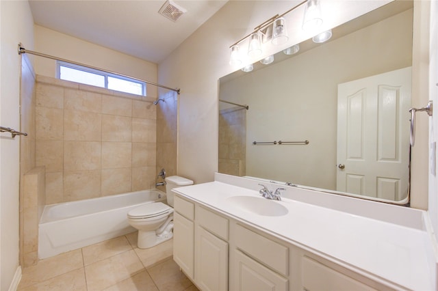 full bathroom with vanity, toilet, tiled shower / bath combo, and tile patterned flooring