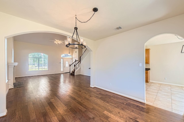 interior space featuring an inviting chandelier and light hardwood / wood-style floors