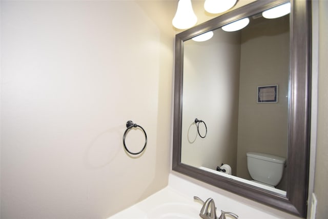 bathroom with sink and toilet