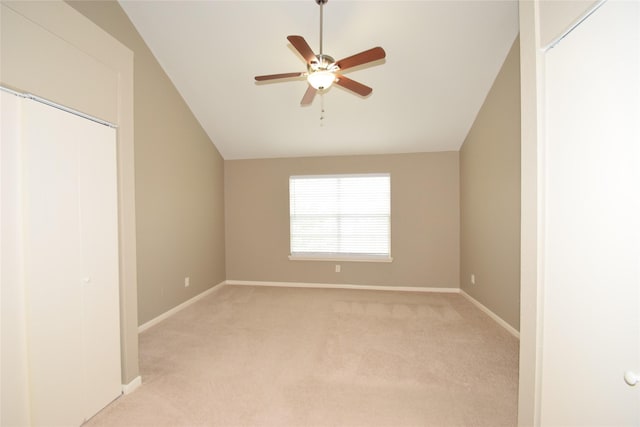 interior space featuring ceiling fan and vaulted ceiling