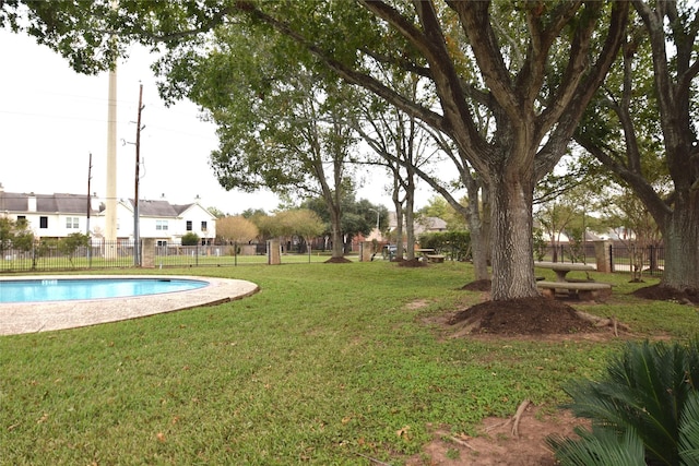 view of yard with a community pool