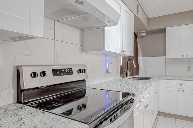 kitchen with sink, electric range, exhaust hood, and white cabinets