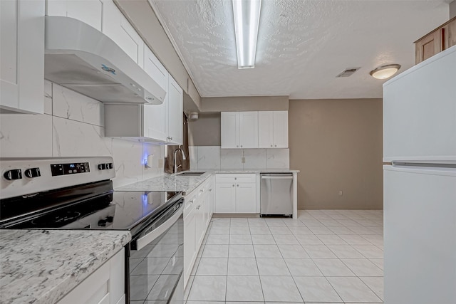 kitchen featuring extractor fan, sink, white cabinets, and appliances with stainless steel finishes