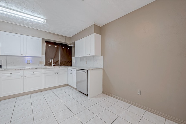 kitchen featuring white cabinetry, dishwasher, light stone counters, and decorative backsplash