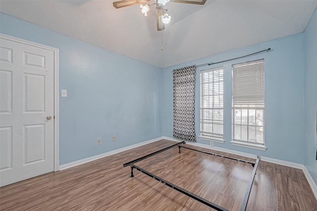 unfurnished bedroom featuring ceiling fan and hardwood / wood-style floors