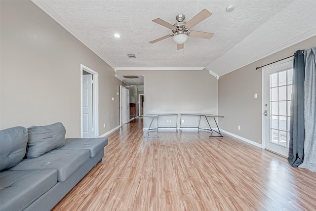 living room with ceiling fan, crown molding, light hardwood / wood-style flooring, and a textured ceiling