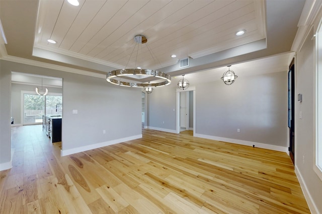 unfurnished room featuring light wood-type flooring, ornamental molding, a tray ceiling, wooden ceiling, and a chandelier