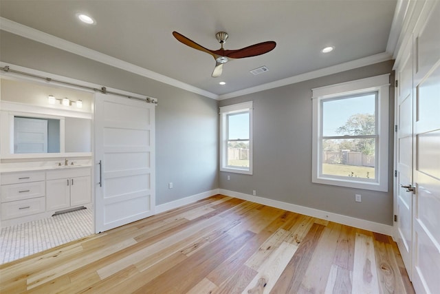 unfurnished bedroom featuring ceiling fan, light hardwood / wood-style floors, ornamental molding, and multiple windows