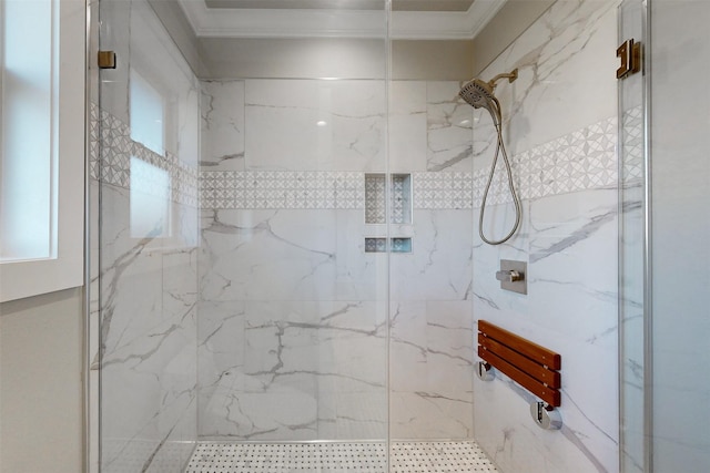 bathroom featuring a tile shower and crown molding