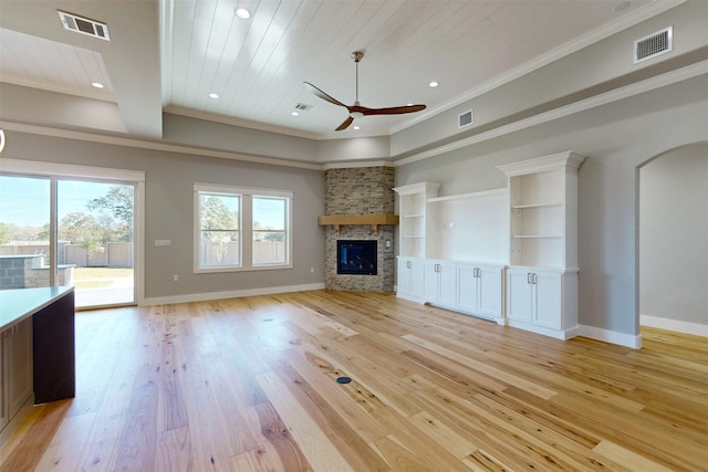 unfurnished living room featuring ceiling fan, light hardwood / wood-style flooring, crown molding, a fireplace, and wood ceiling