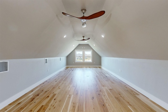 additional living space with light hardwood / wood-style flooring, ceiling fan, and lofted ceiling