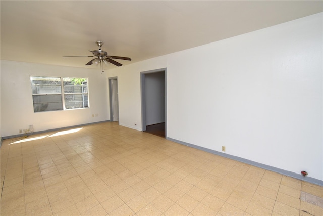 spare room with ceiling fan